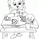 free printable schoolboy sitting at desk page